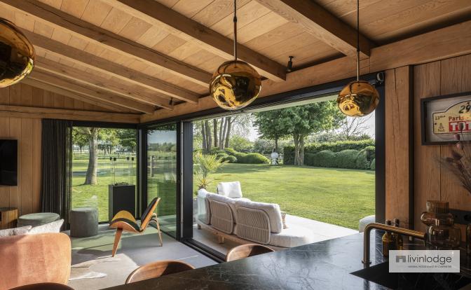 Interior with exposed roof boards and solid oak beams in a modern garden room Interior with exposed roof boards and solid oak beams in a modern garden room