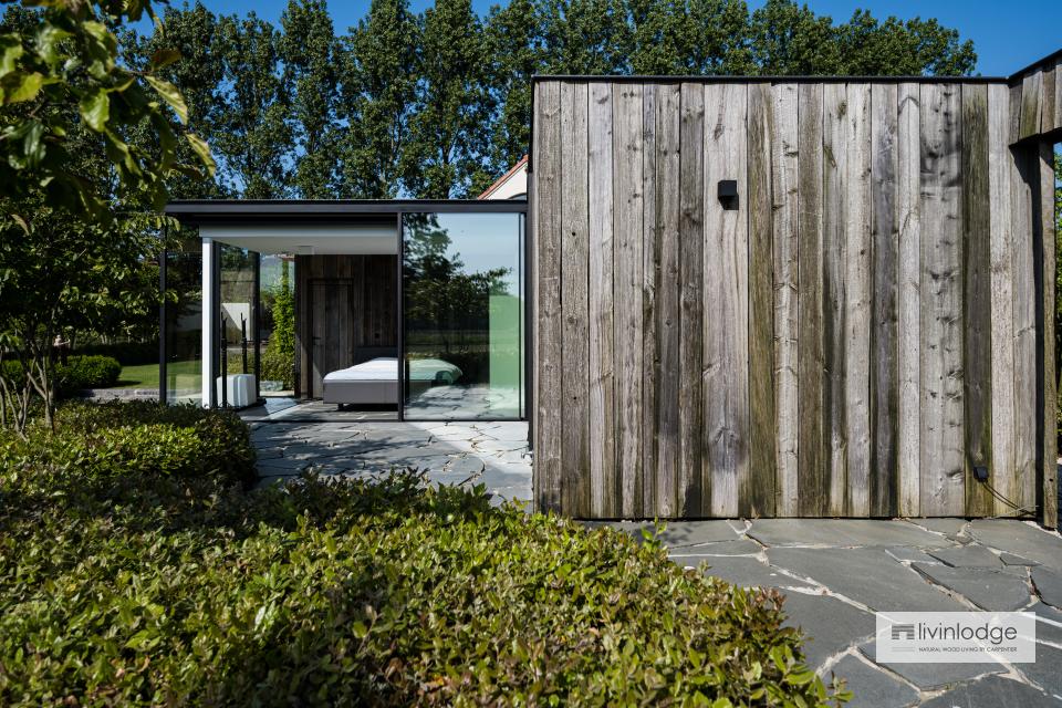 Luxurious wooden garden room in barnwood with sliding glass doors Luxurious wooden garden room in barnwood with sliding glass doors